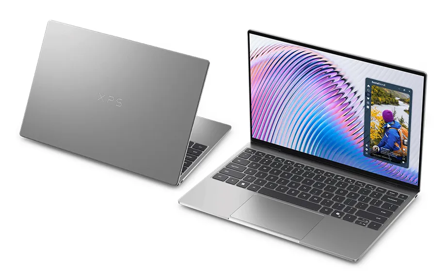 Dwa laptopy Dell XPS 13 - jeden zamknięty, tyłem, drugi otwarty z kolorową grafiką na ekranie